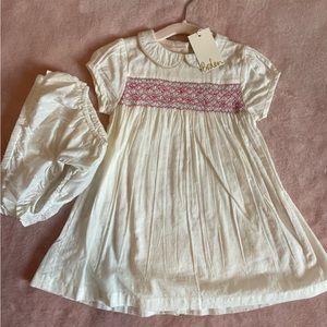 Ivory Boden dress with pink smocked detail sized 12-18M